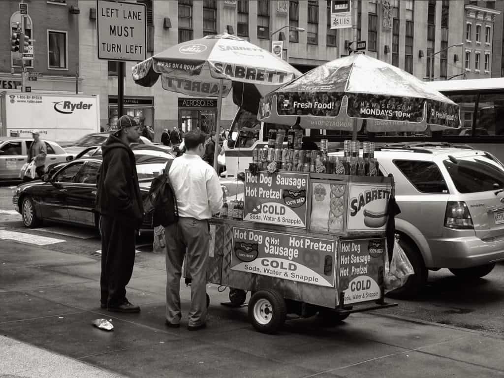 Sidewalk vendors on busy street
