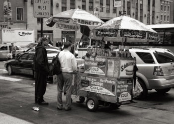 Sidewalk vendors on busy street