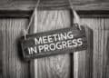 meeting in progress sign