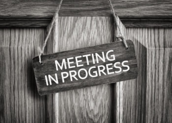 meeting in progress sign
