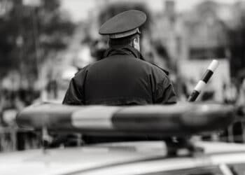 Policeman near his vehicle